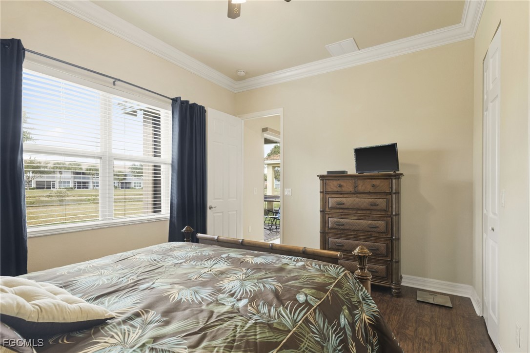 11040 Yellow Poplar Drive Fort Myers, FL 33913 - Photo 12 of 35 a bedroom with a bed and a window