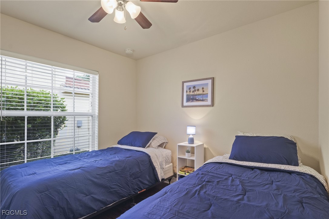 11040 Yellow Poplar Drive Fort Myers, FL 33913 - Photo 14 of 35 a bedroom with a bed and a window