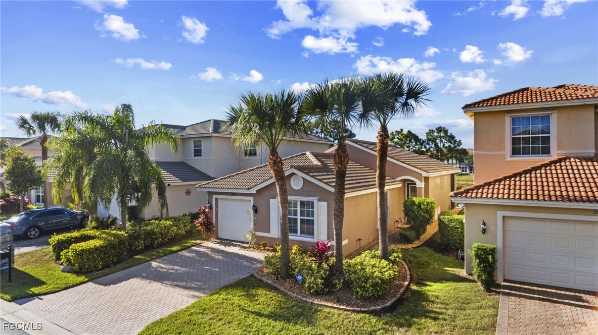 11040 Yellow Poplar Drive Fort Myers, FL 33913 - Photo 21 of 35 a front view of a house with garden