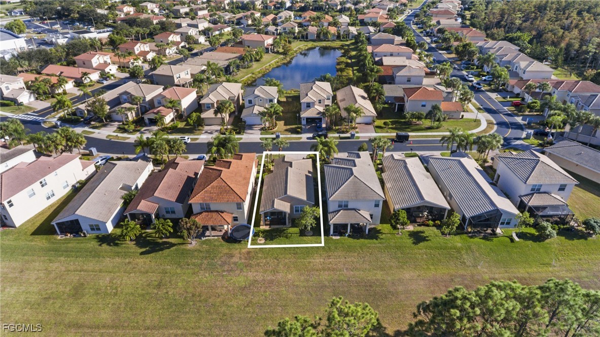 11040 Yellow Poplar Drive Fort Myers, FL 33913 - Photo 24 of 35 an aerial view of residential houses with outdoor space and street view