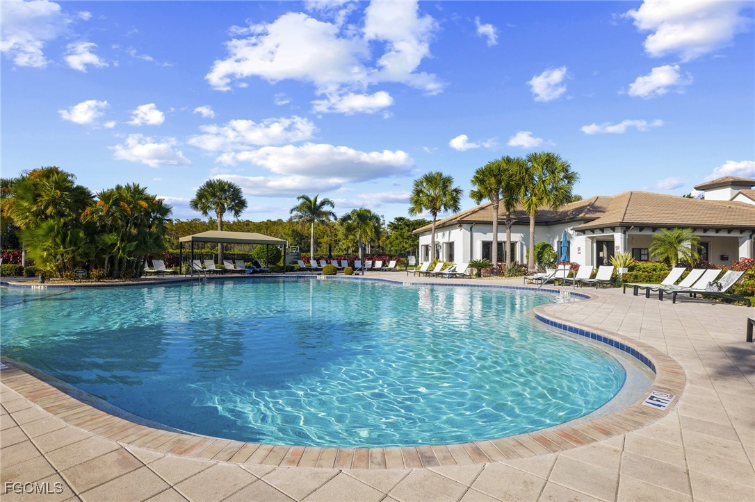 11040 Yellow Poplar Drive Fort Myers, FL 33913 - Photo 26 of 35 a view of a lake with a house