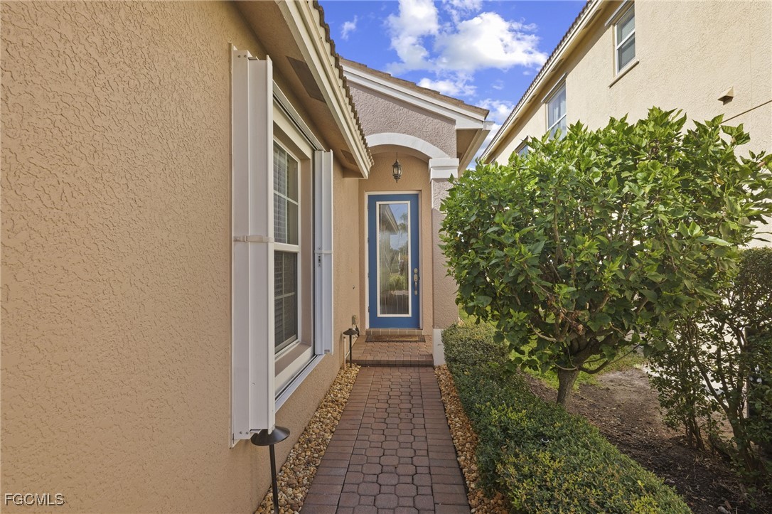 11040 Yellow Poplar Drive Fort Myers, FL 33913 - Photo 3 of 35 a view of a door and chair