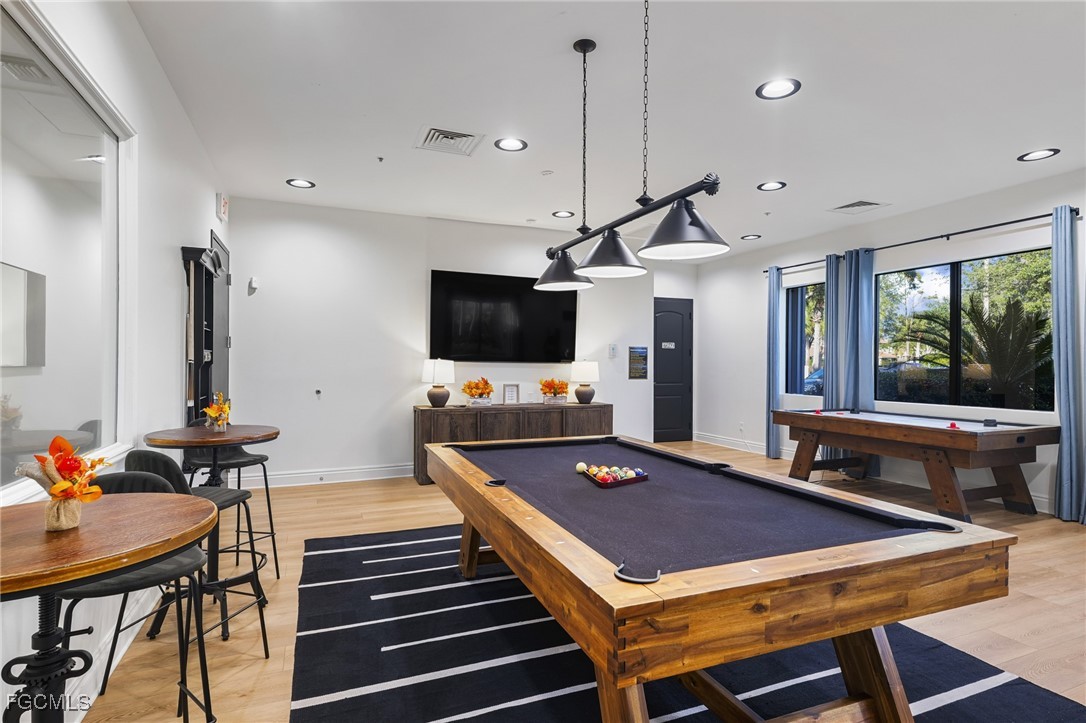 11040 Yellow Poplar Drive Fort Myers, FL 33913 - Photo 32 of 35 a room with furniture pool table flat screen tv and a large window