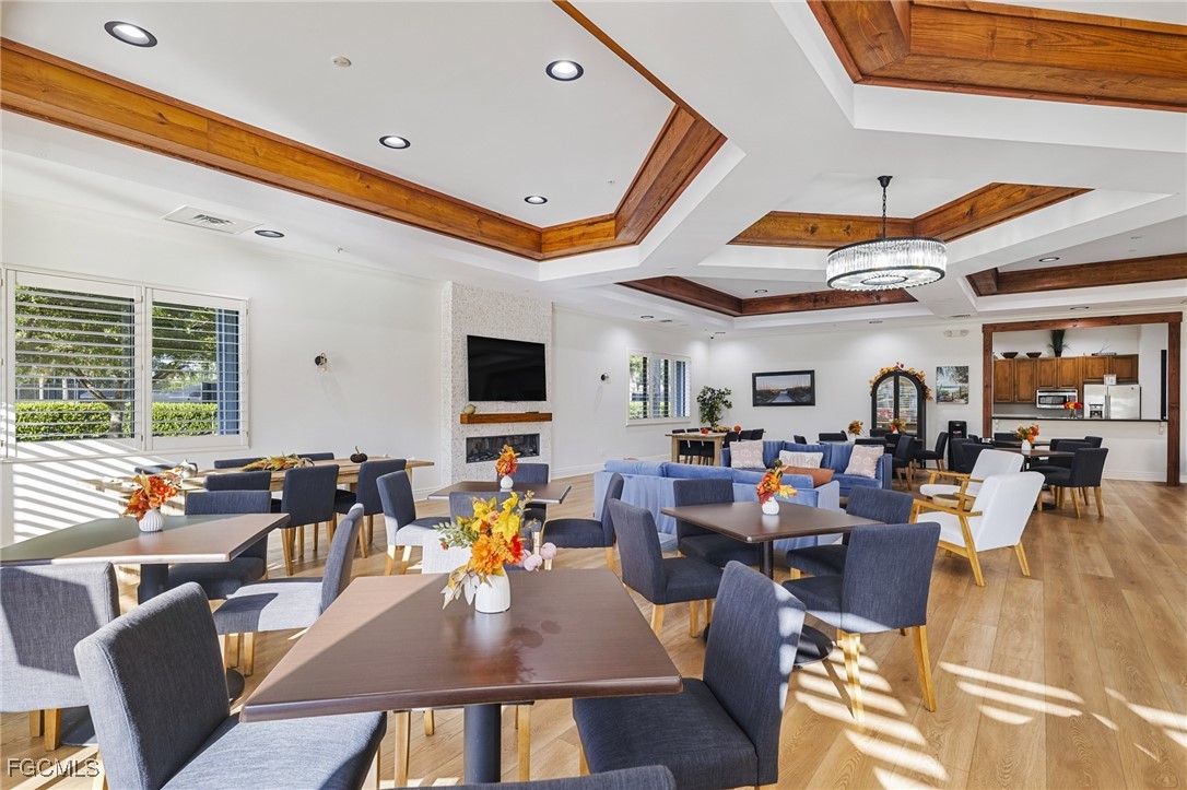 11040 Yellow Poplar Drive Fort Myers, FL 33913 - Photo 33 of 35 a living room with furniture kitchen view and a large window