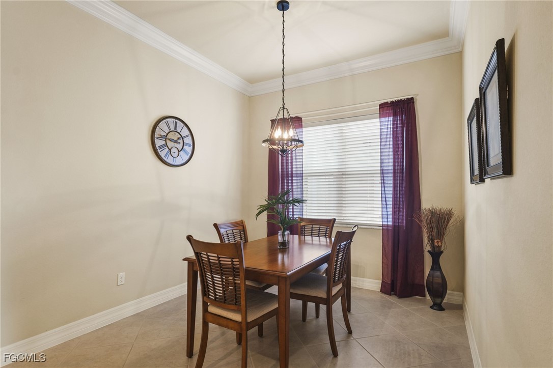 11040 Yellow Poplar Drive Fort Myers, FL 33913 - Photo 9 of 35 a view of a dining room with furniture window and wooden floor