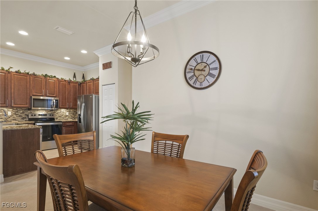 11040 Yellow Poplar Drive Fort Myers, FL 33913 - Photo 10 of 35 a view of a dining area with furniture