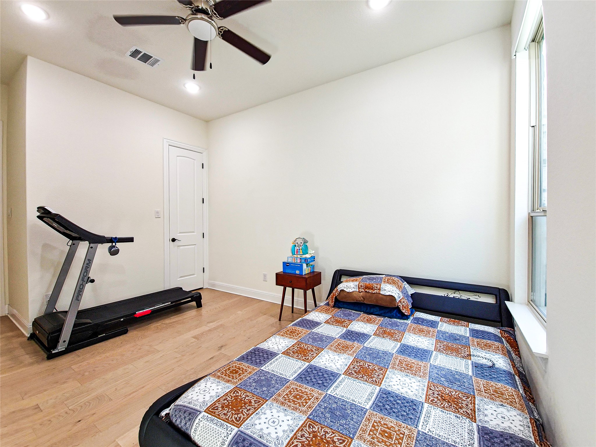 813 Sunny Ridge Drive Leander, TX 78641 - Photo 21 of 32 Hardwood floors and a ceiling fan create comfort in this naturally illuminated room.