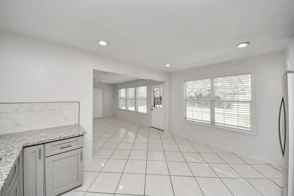 a view of an empty room and window
