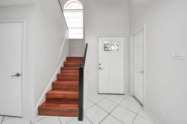 a view of entryway with wooden floor