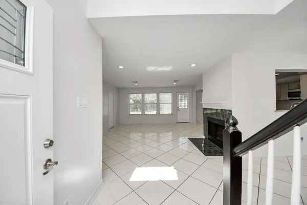 a view of entryway and hall with a window