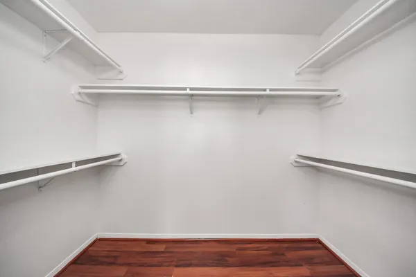 a view of a room with shelf on the wall