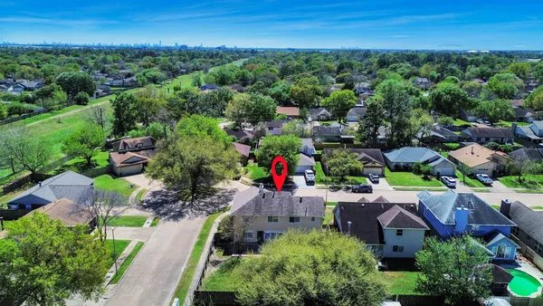 an aerial view of a house with a garden