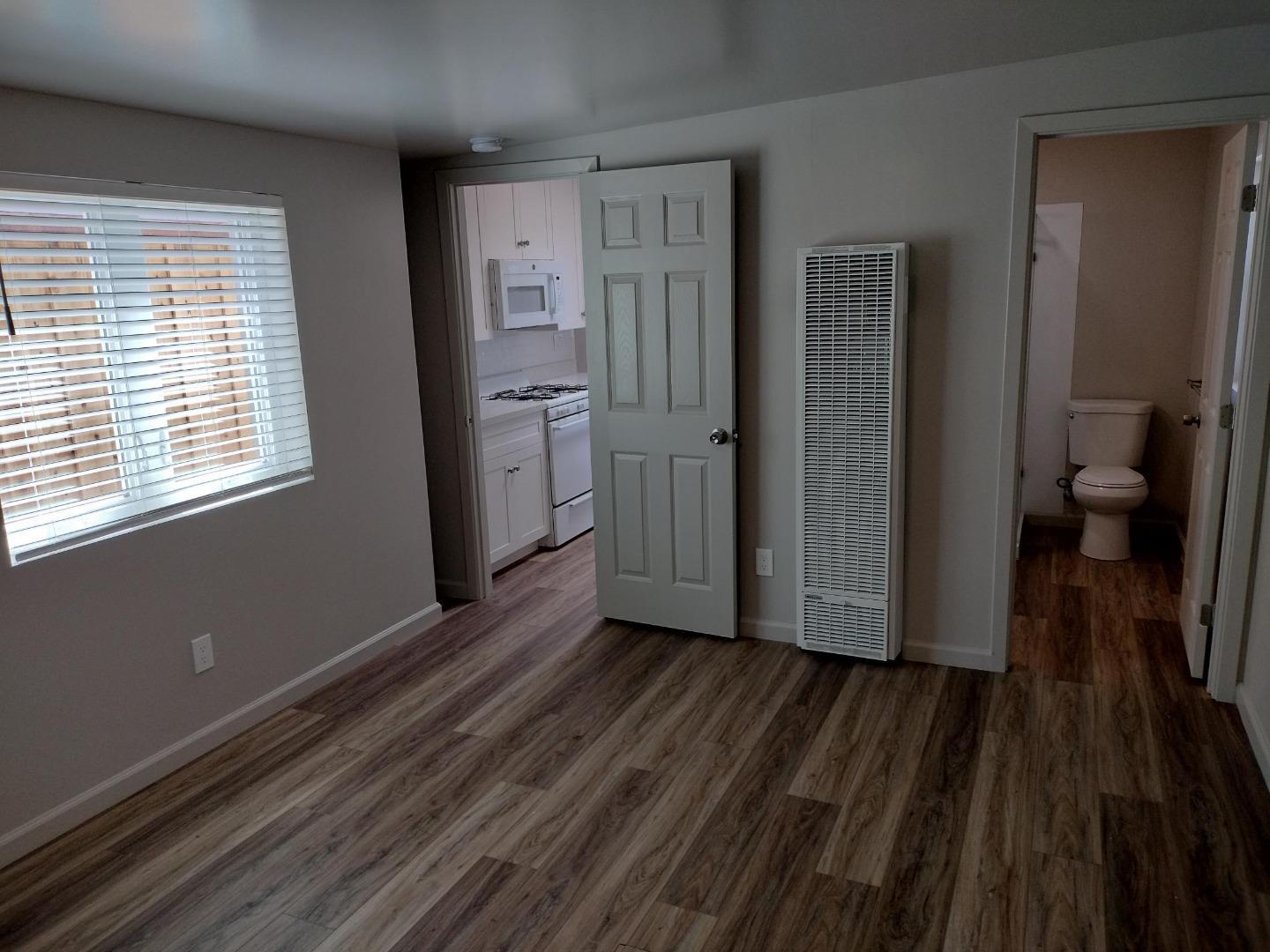 413-415 Dela Rosa Avenue Monterey, CA 93940 - Photo 14 of 22 a view of a room with wooden floor and a sink