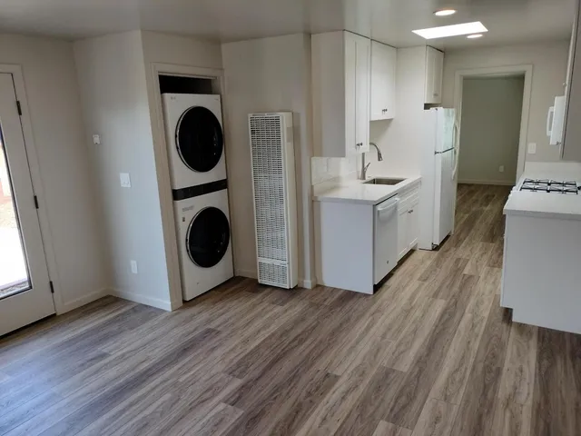 a view of a kitchen with washer and dryer