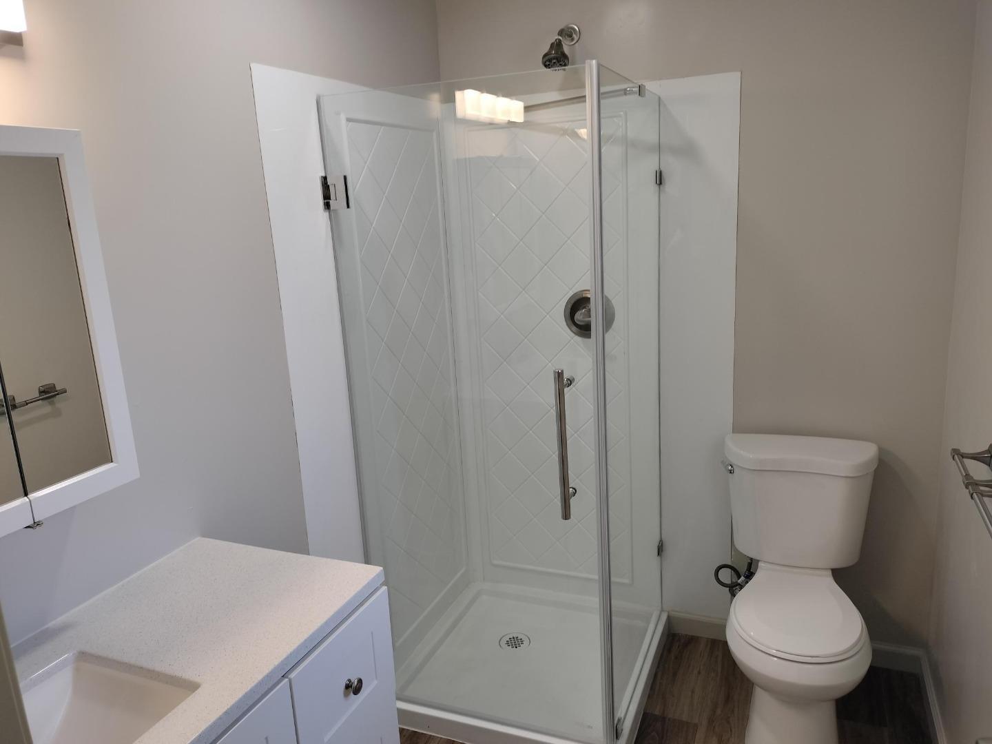 413-415 Dela Rosa Avenue Monterey, CA 93940 - Photo 19 of 22 a white toilet sitting next to a bathroom sink