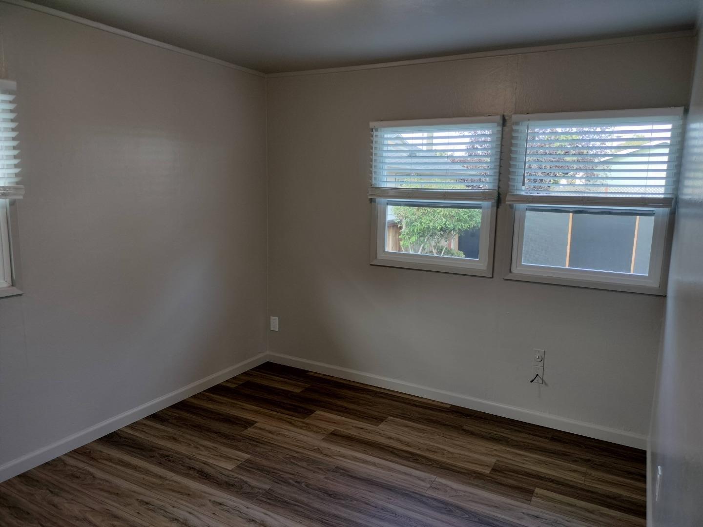 413-415 Dela Rosa Avenue Monterey, CA 93940 - Photo 5 of 22 a view of empty room with wooden floor and fan