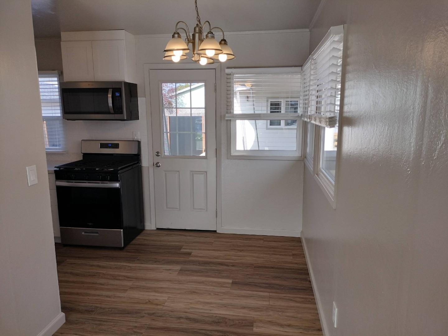 413-415 Dela Rosa Avenue Monterey, CA 93940 - Photo 10 of 22 a kitchen with stainless steel appliances granite countertop a refrigerator and a stove top oven