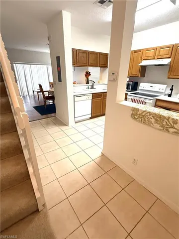 a kitchen with stainless steel appliances a sink and a stove