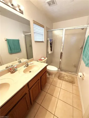a bathroom with a sink a mirror and a shower