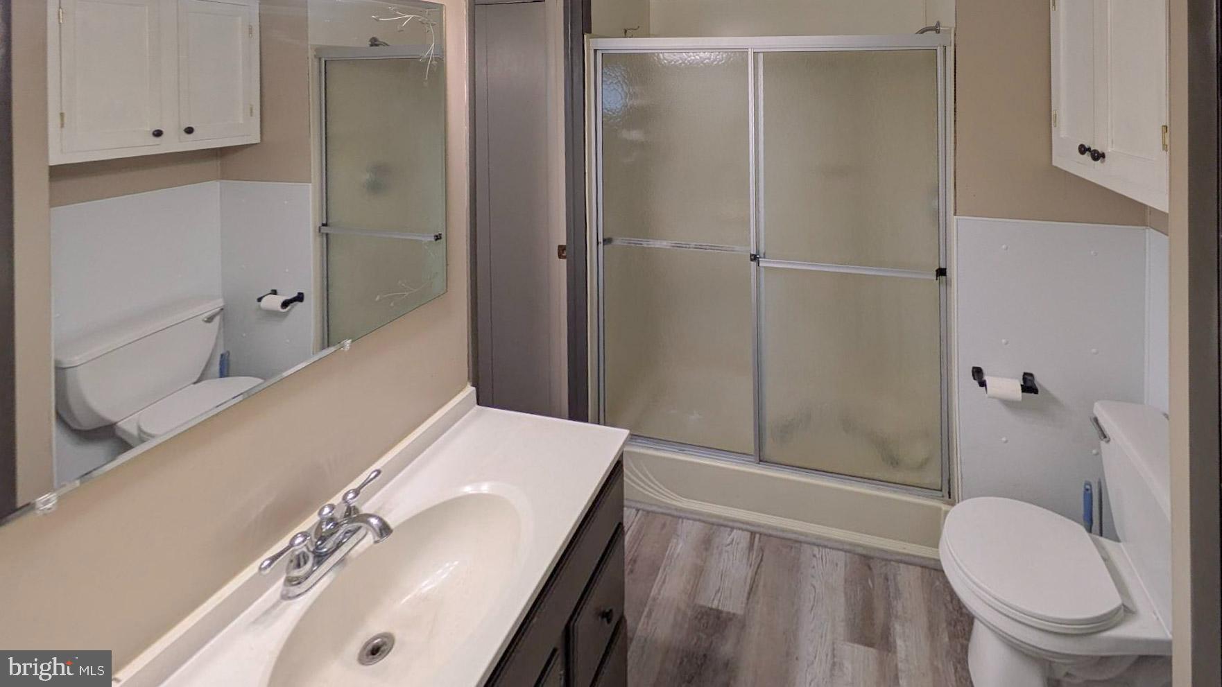 3806 Locust Grove Road Columbia, PA 17512 - Photo 15 of 27 a bathroom with a sink a toilet and shower
