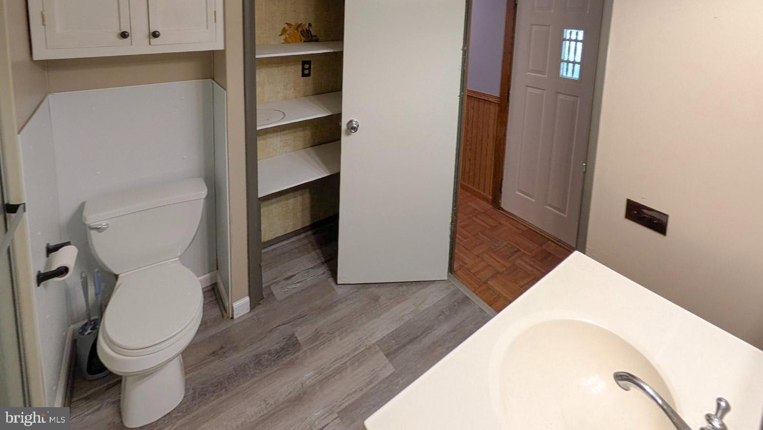 3806 Locust Grove Road Columbia, PA 17512 - Photo 16 of 27 a white toilet sitting next to a bathroom sink