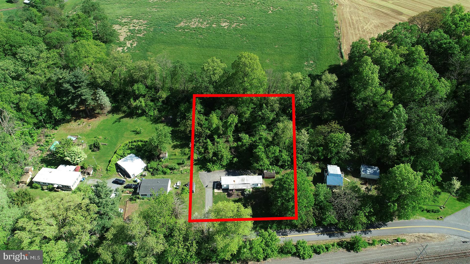 3806 Locust Grove Road Columbia, PA 17512 - Photo 3 of 27 an aerial view of a house with lots of trees and flowers