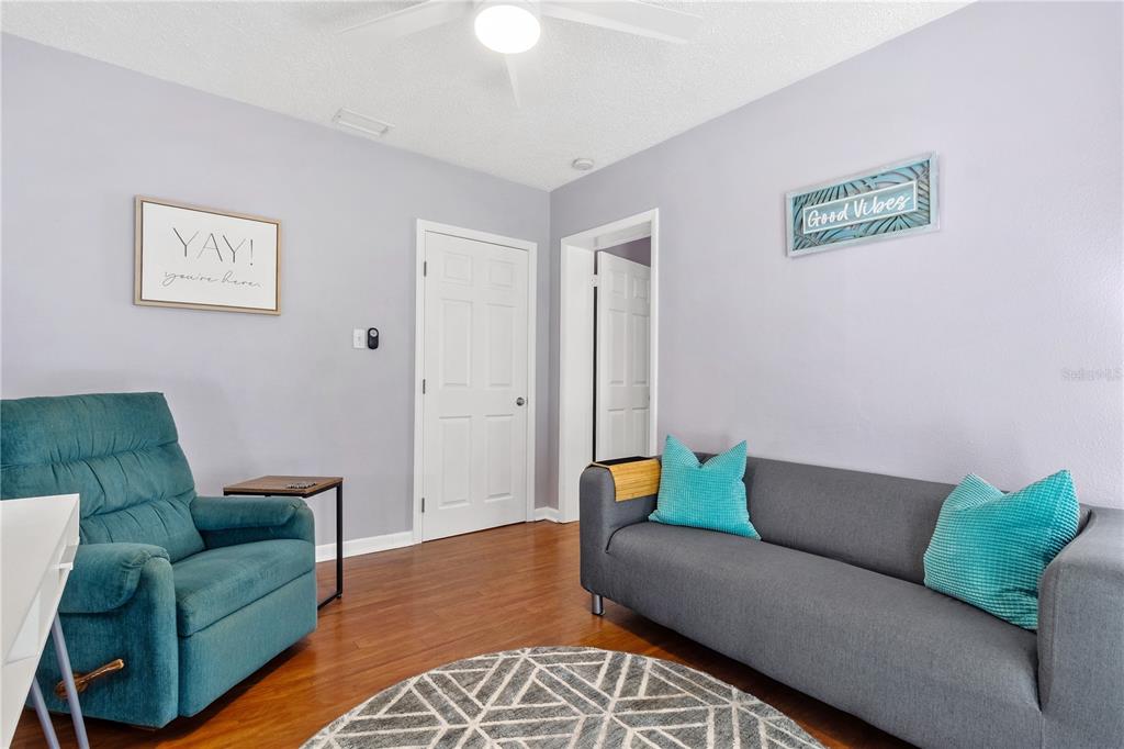 5596 100th Way North St. Petersburg, FL 33708 - Photo 26 of 67 a living room with furniture and a couch