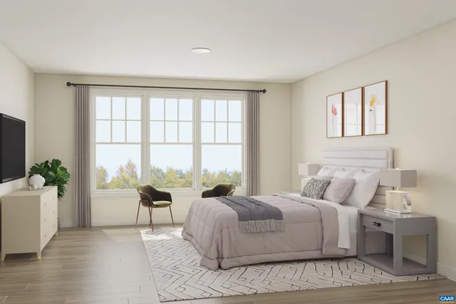 a spacious bedroom with a large bed and a large window