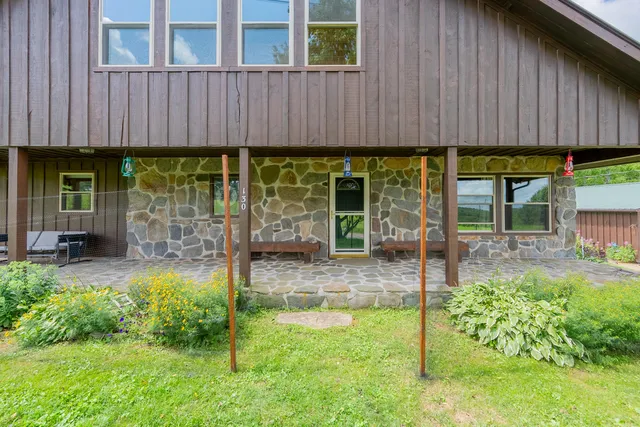 an aerial view of a swimming pool with a yard