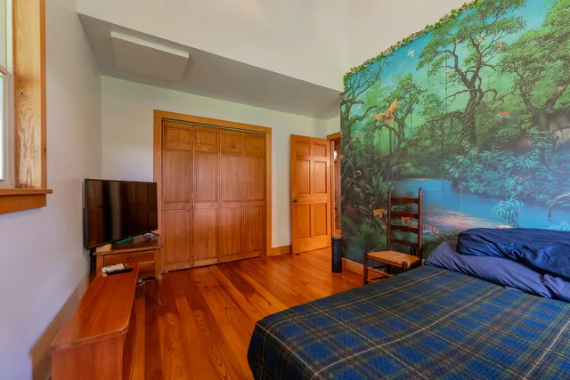 a room with gym equipment and a large window