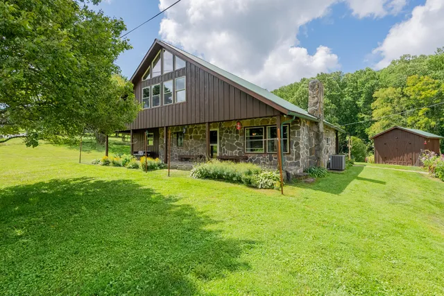a view of a porch with wooden floor and stairs