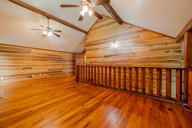 a backyard of a house with barbeque oven and outdoor seating