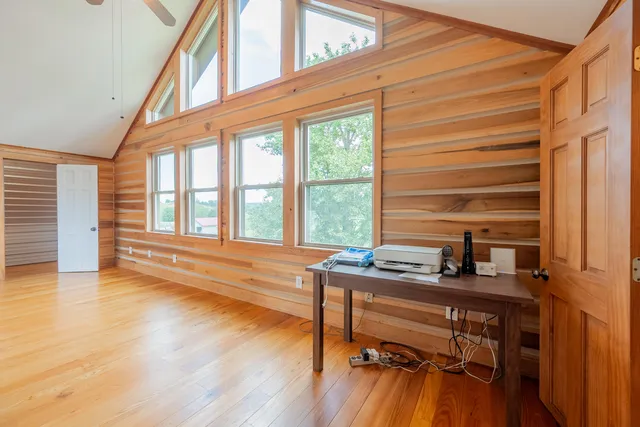 a view of a porch with furniture and garden