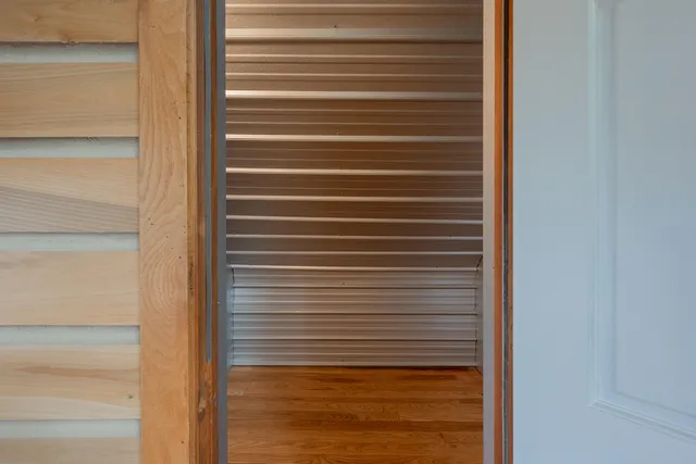 a view of a deck with wooden floor and outdoor seating