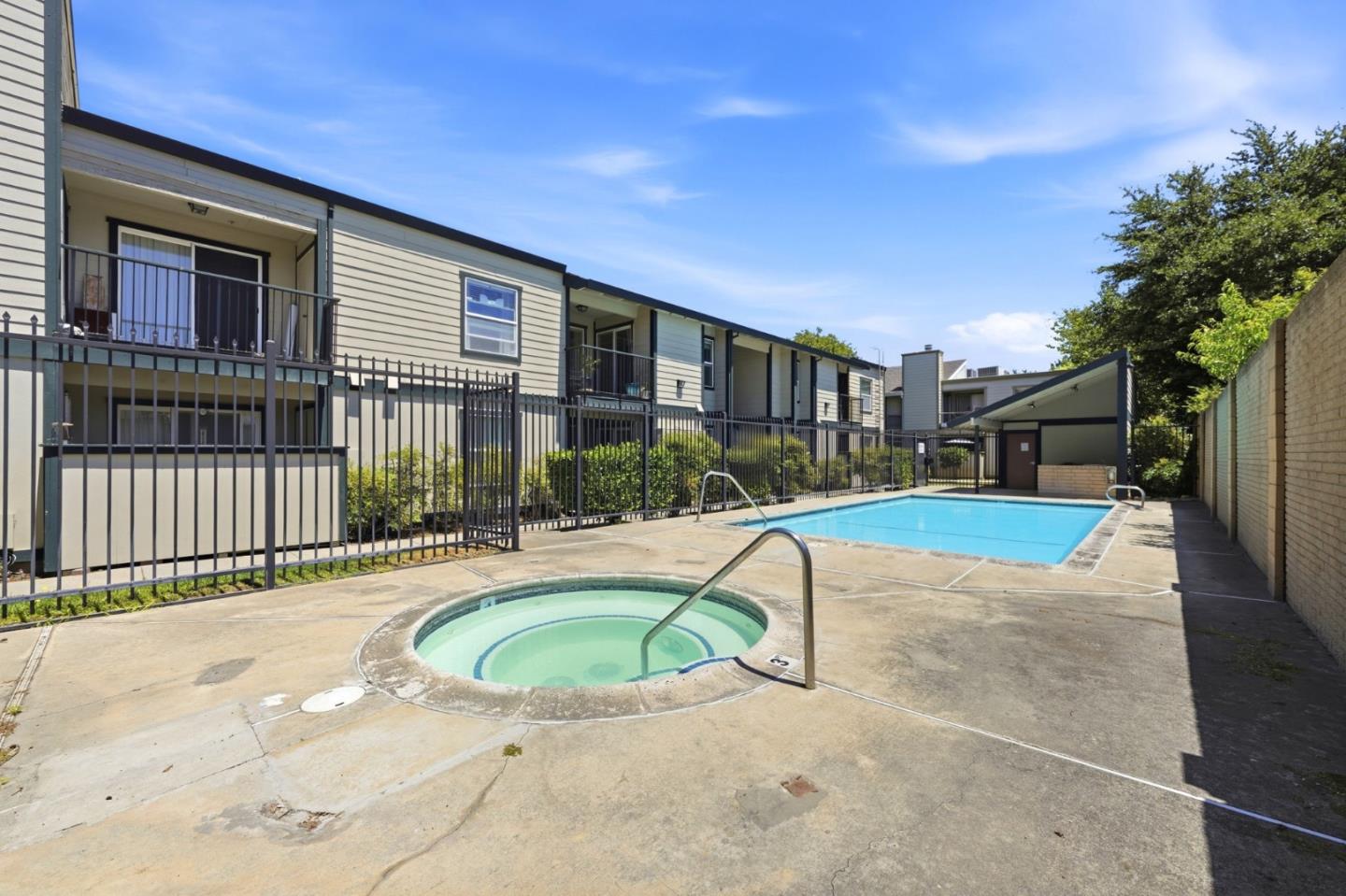 7283 Florin Road, Unit 8 Sacramento, CA 95828 - Photo 33 of 35 a view of a house with swimming pool and porch