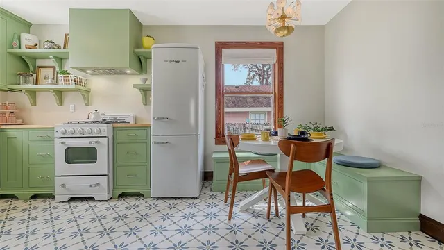 a kitchen with a stove and a sink