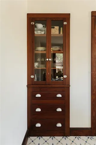 a bathroom with a granite countertop sink a toilet and shower