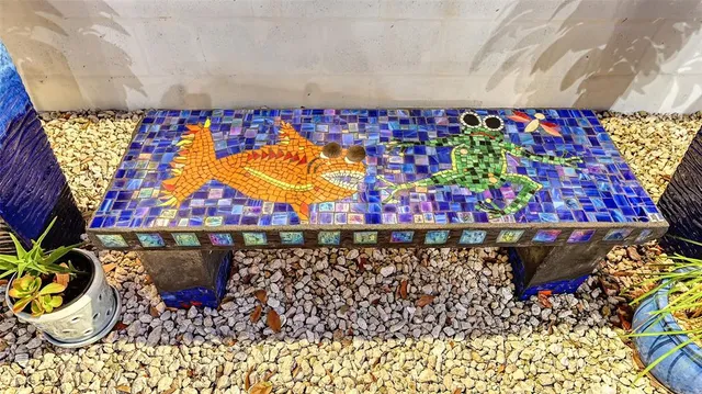 a dining room with furniture a chandelier and wooden floor