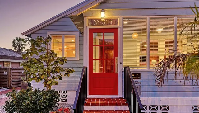 a view of a balcony with outdoor seating