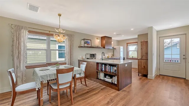 a bathroom with a sink a toilet and shower curtain