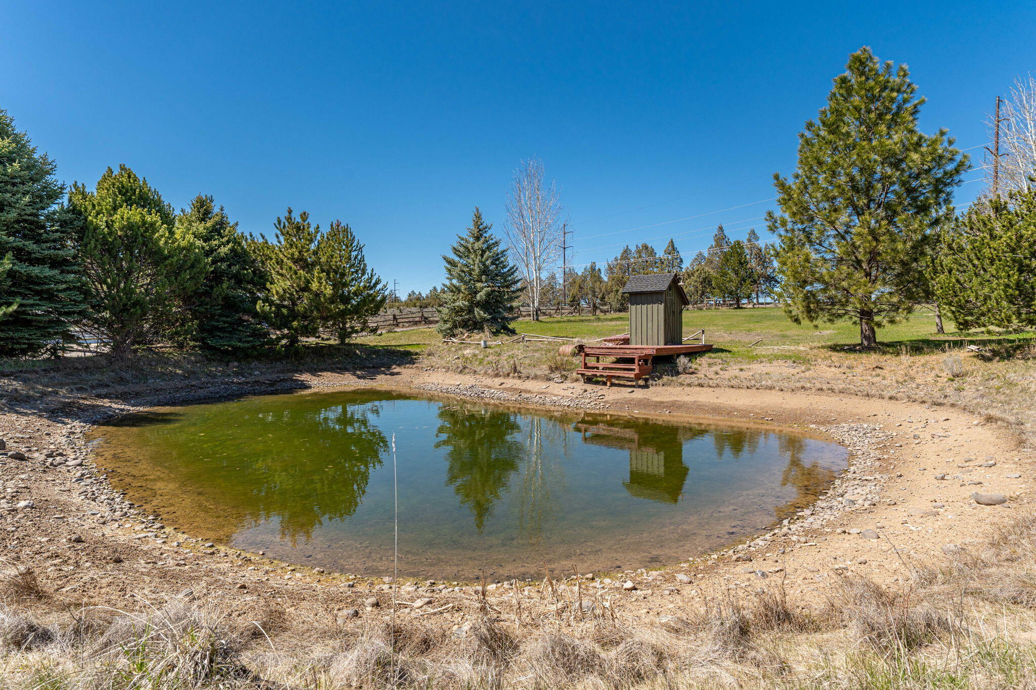 17375 Jordan Road Sisters, OR 97759 - Photo 60 of 63 Irrigation pond with dock for summer fun.