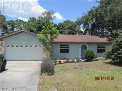 18627 Evergreen Road Fort Myers, FL 33967 - Photo 1 of 4 a front view of a house with yard