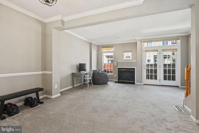 a view of a livingroom with furniture and a fireplace