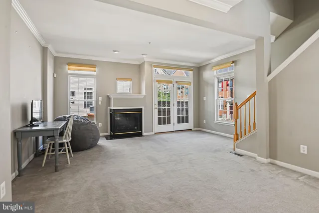 a view of a livingroom with furniture and a fireplace