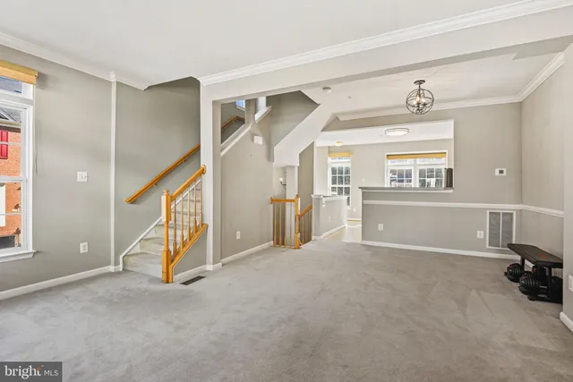 a view of a livingroom with furniture and a window