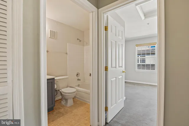 a view of bathroom with a toilet sink