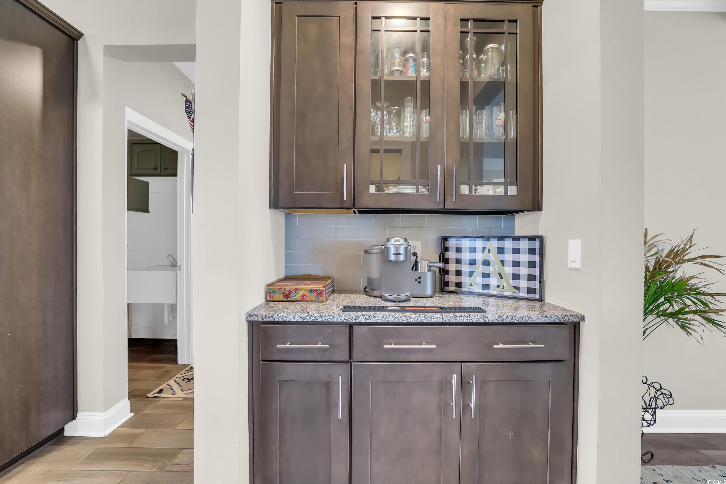 259 Hull Street Surfside Beach, SC 29575 - Photo 12 of 40 Bar area featuring tasteful backsplash and light wood finished floors