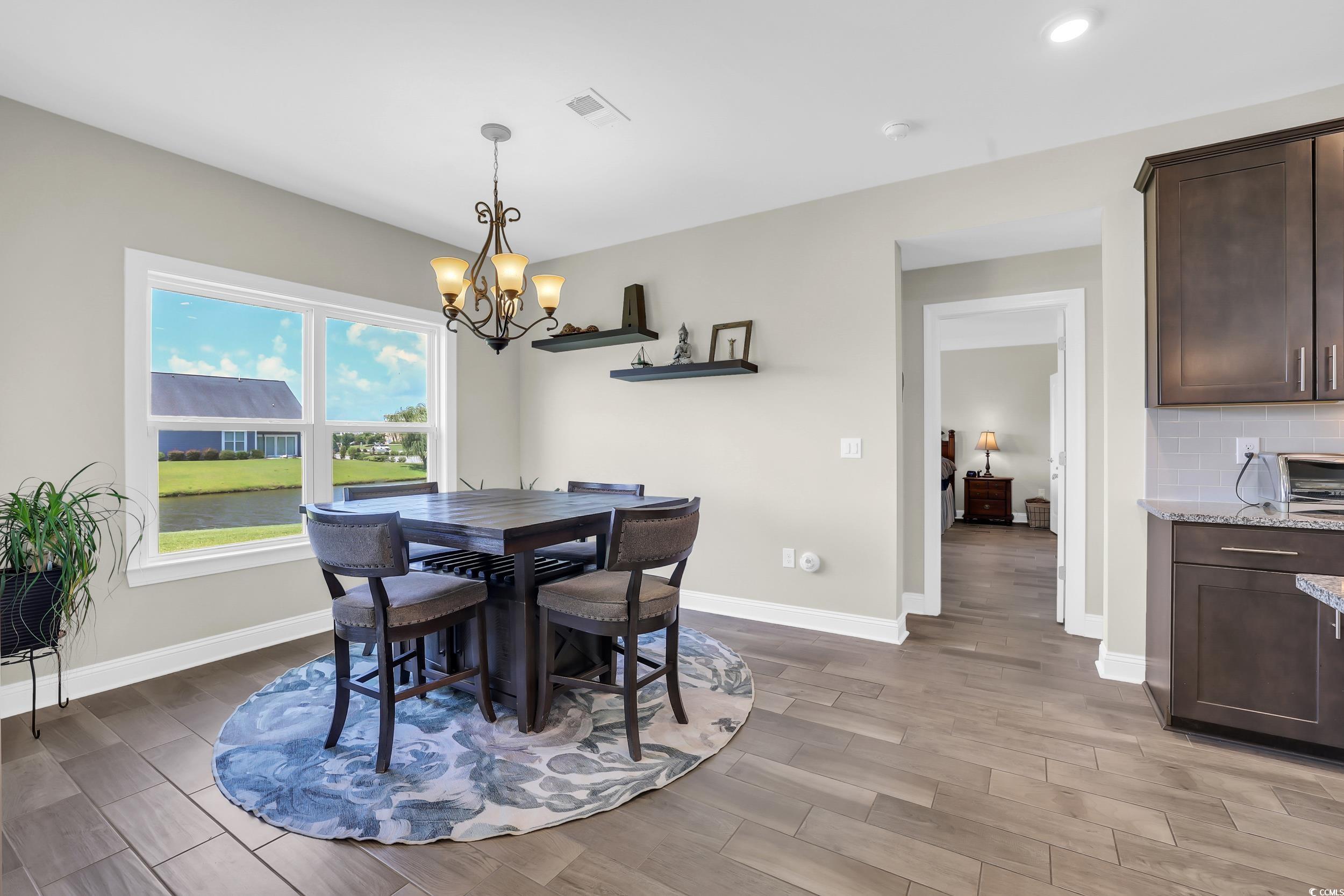 259 Hull Street Surfside Beach, SC 29575 - Photo 13 of 40 Dining area with a chandelier, light wood-type flooring, and recessed lighting