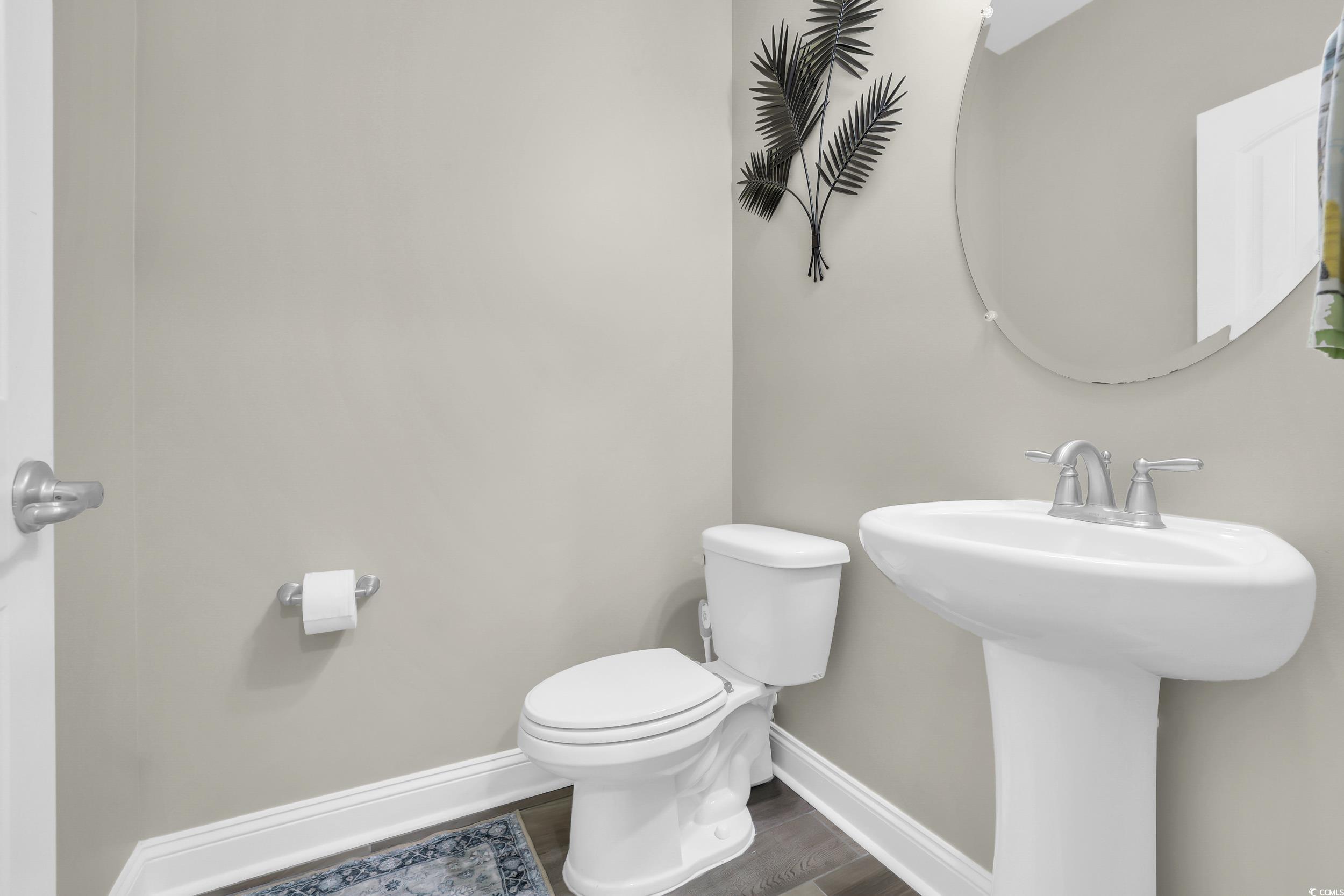 259 Hull Street Surfside Beach, SC 29575 - Photo 14 of 40 Bathroom featuring toilet and wood finished floors