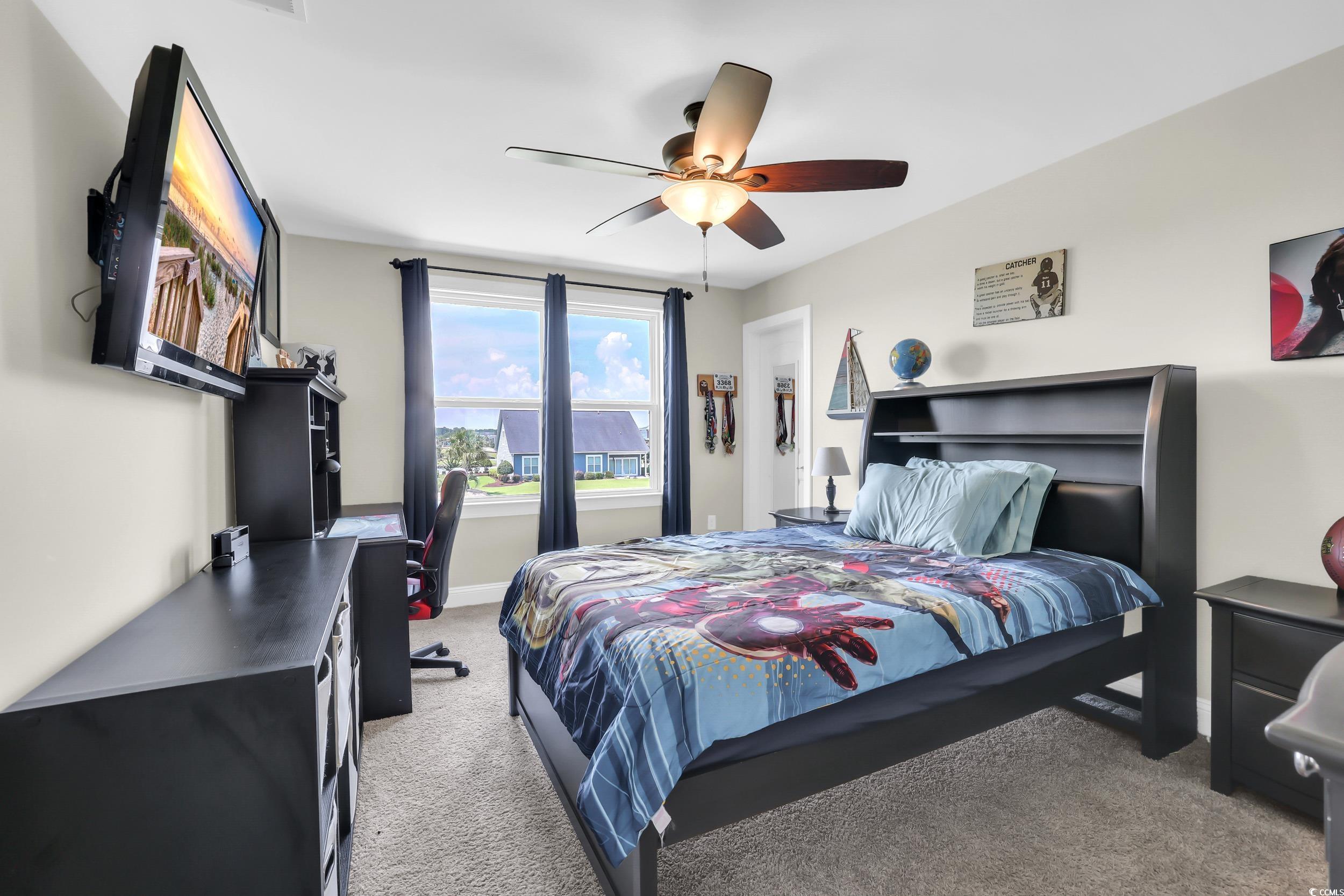 259 Hull Street Surfside Beach, SC 29575 - Photo 28 of 40 Bedroom with light carpet, an office area, and a ceiling fan
